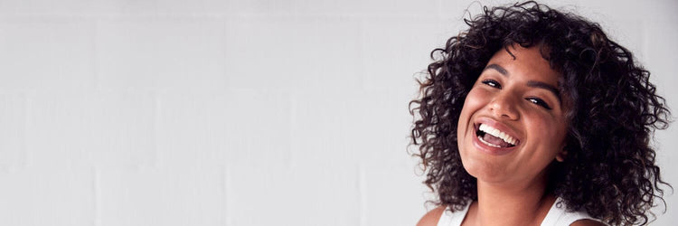 Smiling woman with curly hair