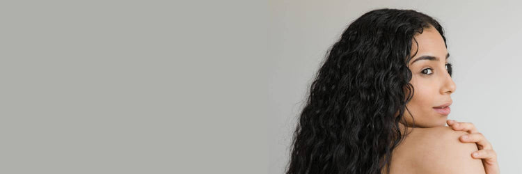 Woman with long dark wavy hair