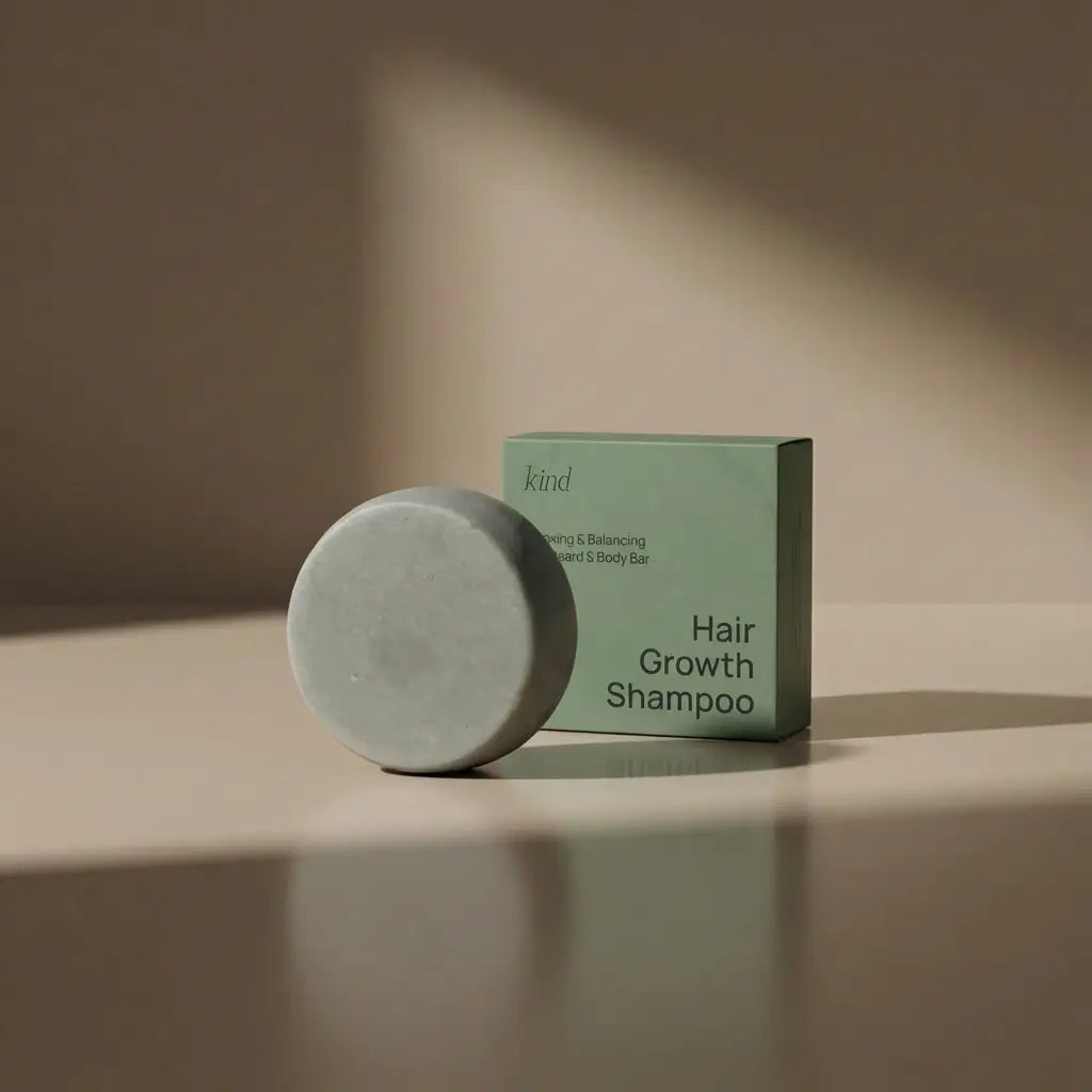 Grey hair growth shampoo bar and packaging on a beige surface with soft shadows