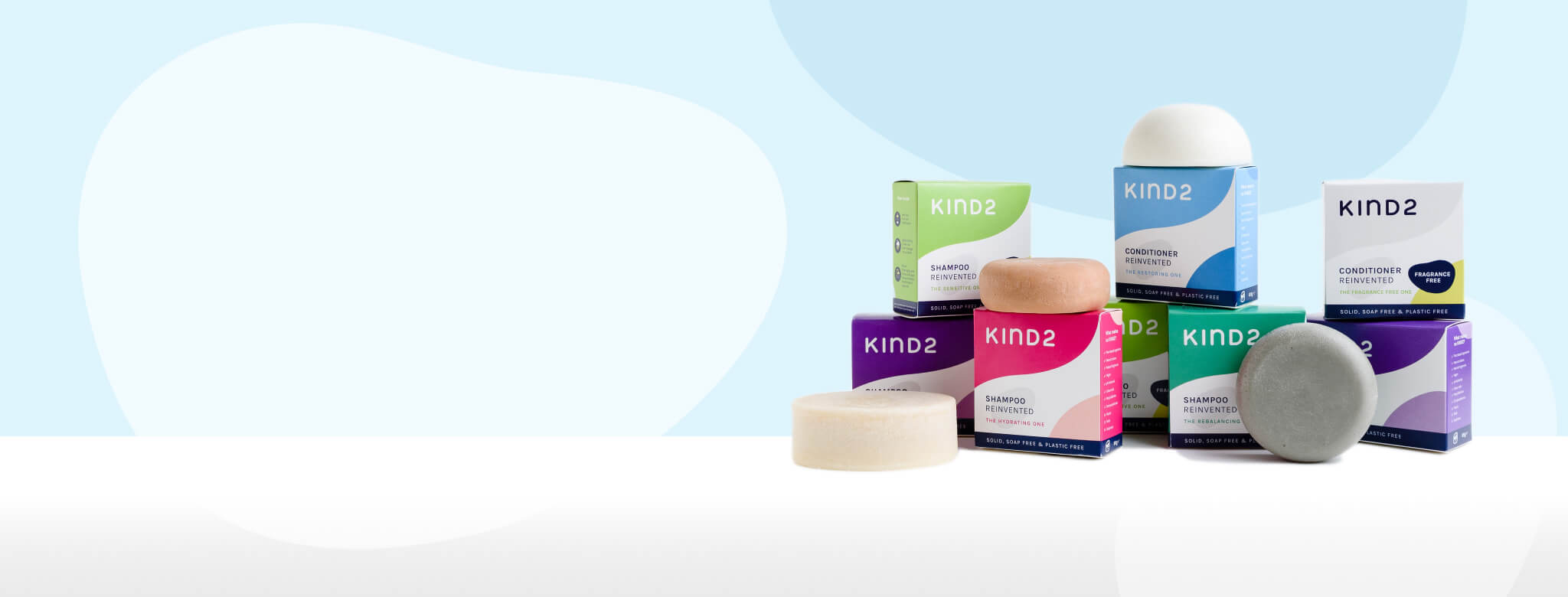 KIND2 Shampoo and Conditioner Bars on blue background